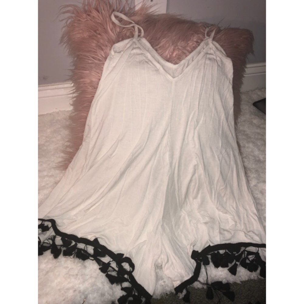 White flowy romper with detailed trim